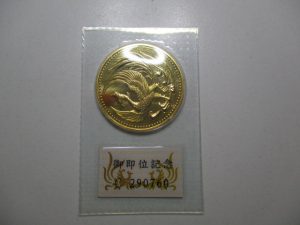 大吉 武蔵小金井店 御即位10万円金貨の画像です。